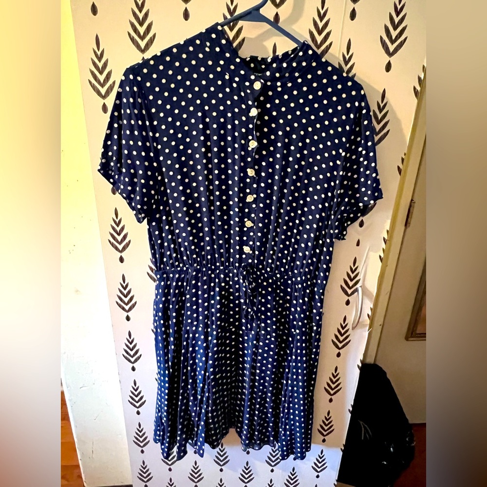 Blue dress with white polka dots.